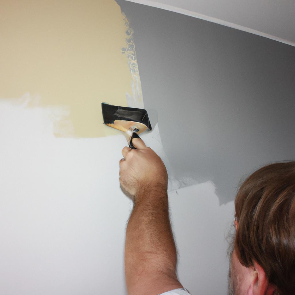 Person applying wall finishes